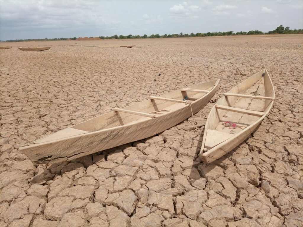 brown wooden boat on brown sand during daytime